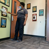 K&T Cleaning Services woman dusting.JPG